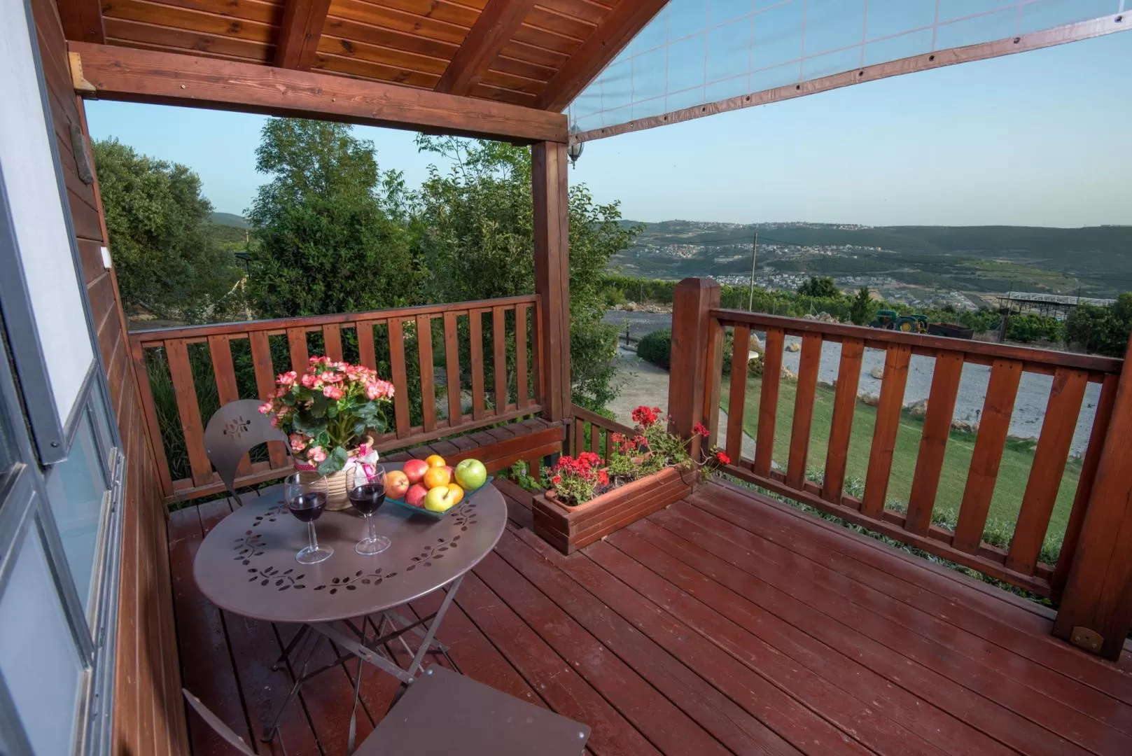 A panoramic view of the Galilee mountains is reflected from the balcony of the cabin - Marganit Bagalil, Tsuriel, Western Galilee