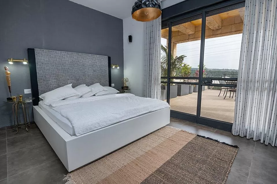 Sleeping area with a queen size bed - Batchi, Manot, Western Galilee