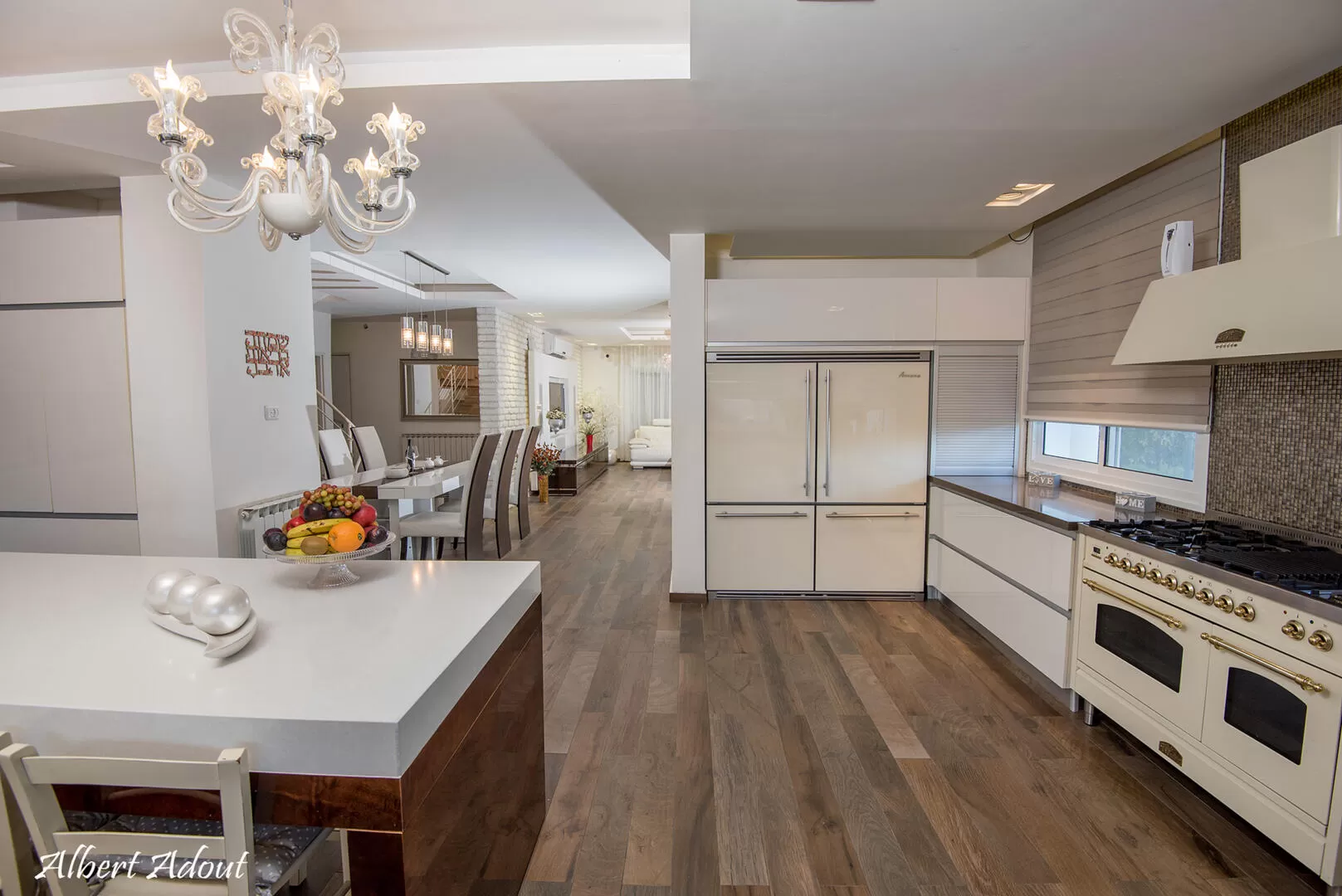 A fully equipped kitchen with a huge oven, a huge refrigerator, a water bar, a coffee grinder and a beautiful island in the center - Ahuzat HaNarkis 42