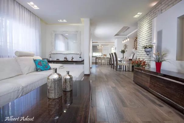 The hospitality space with a cream-colored leather seating area, and a 60-inch smart TV - Ahuzat HaNarkis 42, Rosh Pina, Upper Galilee