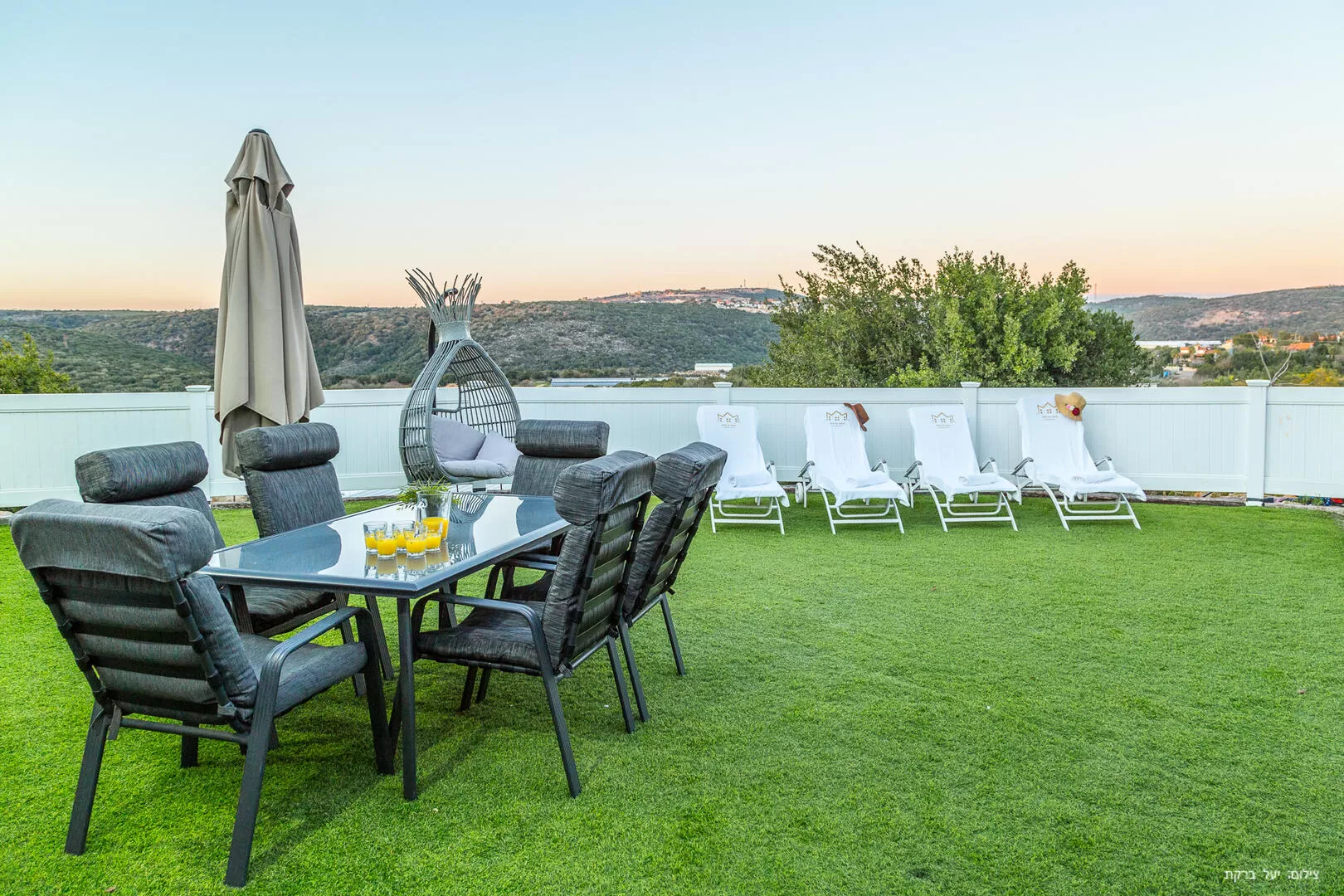 The pool yard includes lounge chairs and overlooks an open view - Ahuza Al HaMayim, Shomera, Western Galilee
