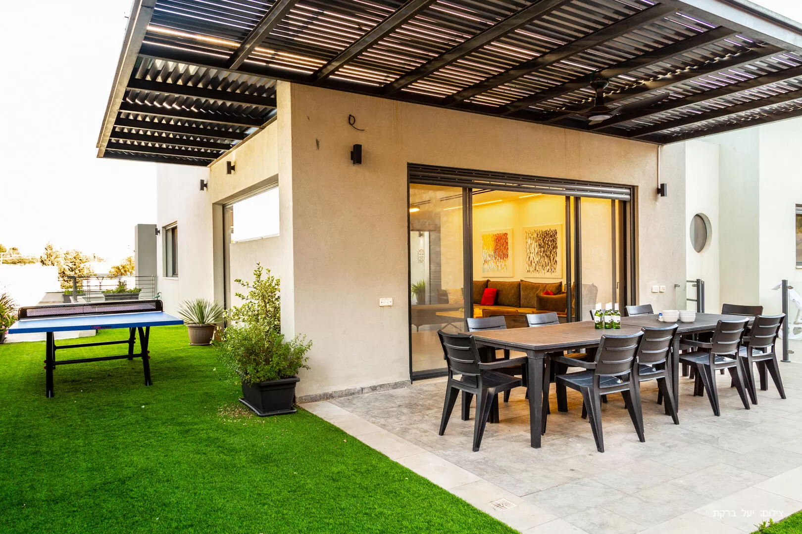 The outdoor area of the villa, with a dining table and a ping pong table for the players among you - Modern Villa, Rosh Pina, Upper Galilee