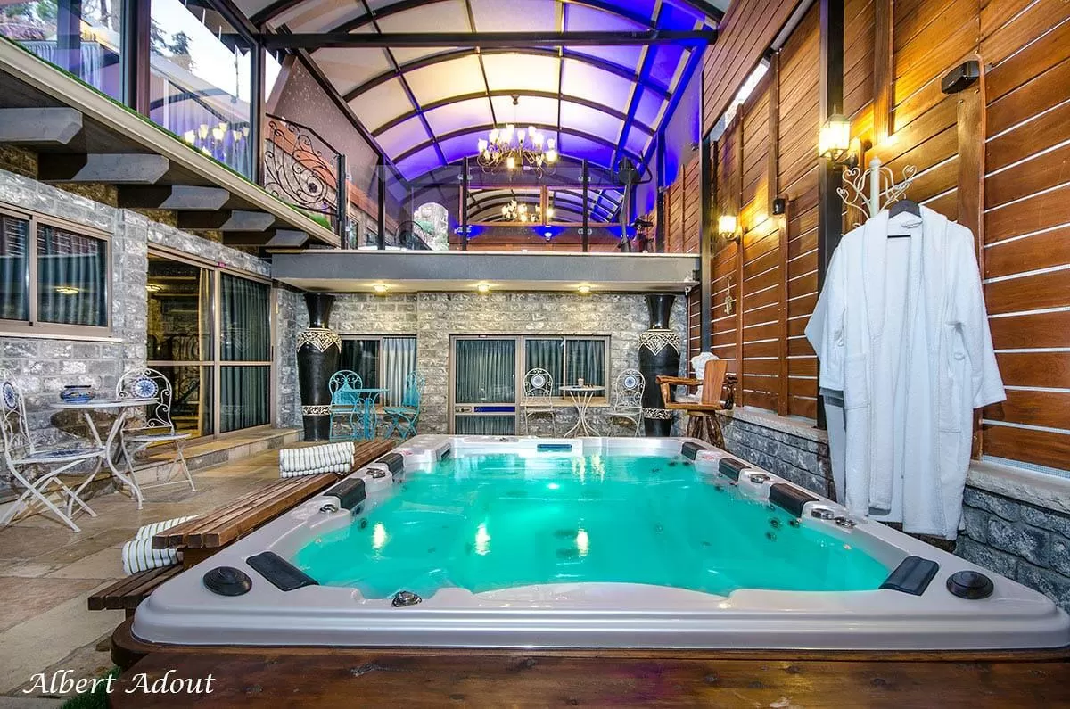 In the center of the villa there is a lively communal recreation area with a spa jacuzzi for eight people, a massage chair, a cozy fireplace, and your own private pub - Villa Andrea