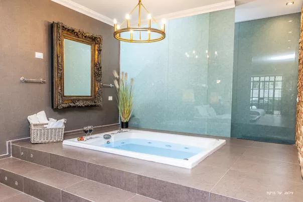 A double indoor Jacuzzi sunken into a magnificent stage - Dreamer Suite couples only, Rosh Pina, Upper Galilee