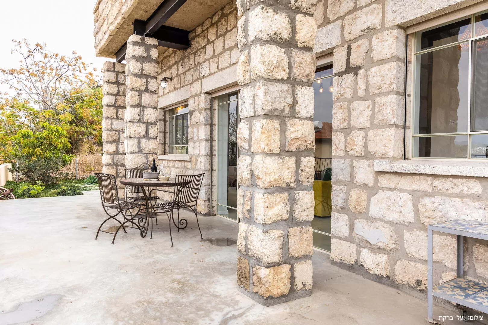 The building is built on the outside with an impressive stone cladding - Atzel Tali, Hof Habonim, Carmel Beach
