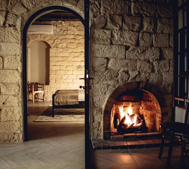 A wood-burning fireplace in the foyer of the room suite - Villa Tehila-Couples Boutique Hotel, Rosh Pina, Upper Galilee