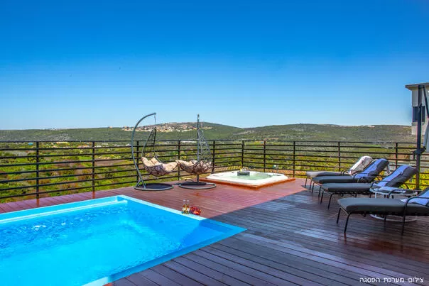The pool and hot tub sit on the open landscape - Omer BaGalil, Even Menahem, Western Galilee